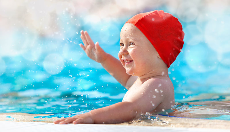 Infant playing in water