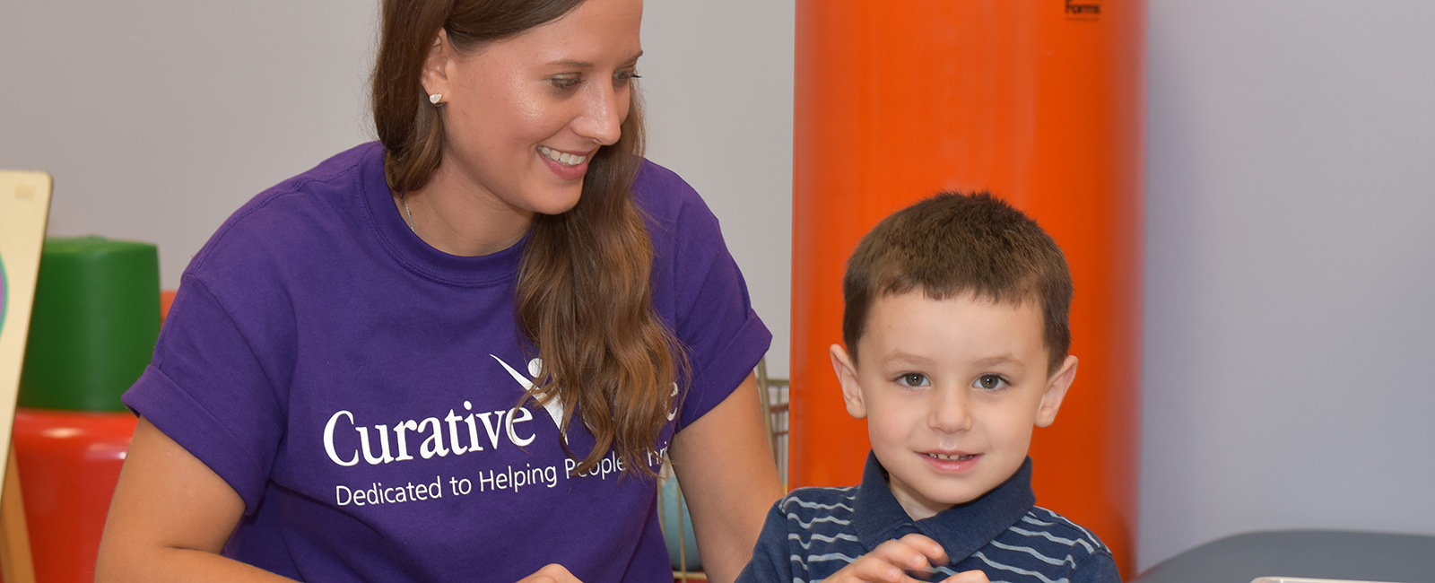 Young boy working with speech therapist